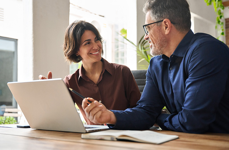 People in meeting talking and smiling.