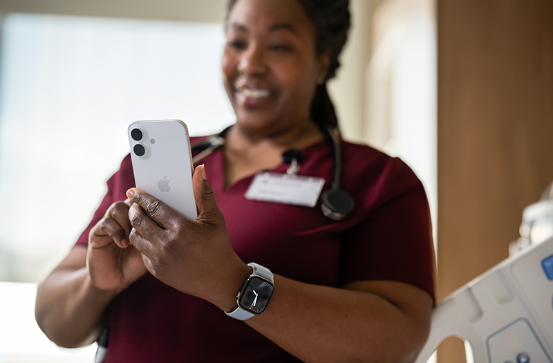 Healthcare nurse using Apple iPhone device