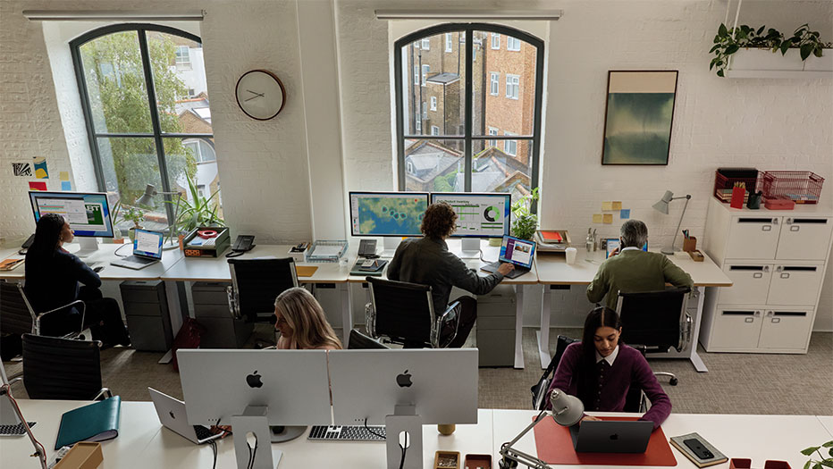 Team on devices in meeting room