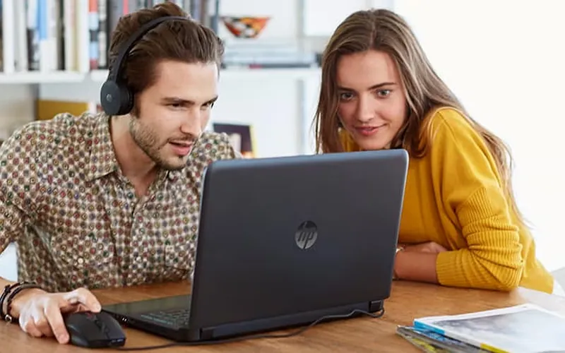 People in a video meeting with a headset.