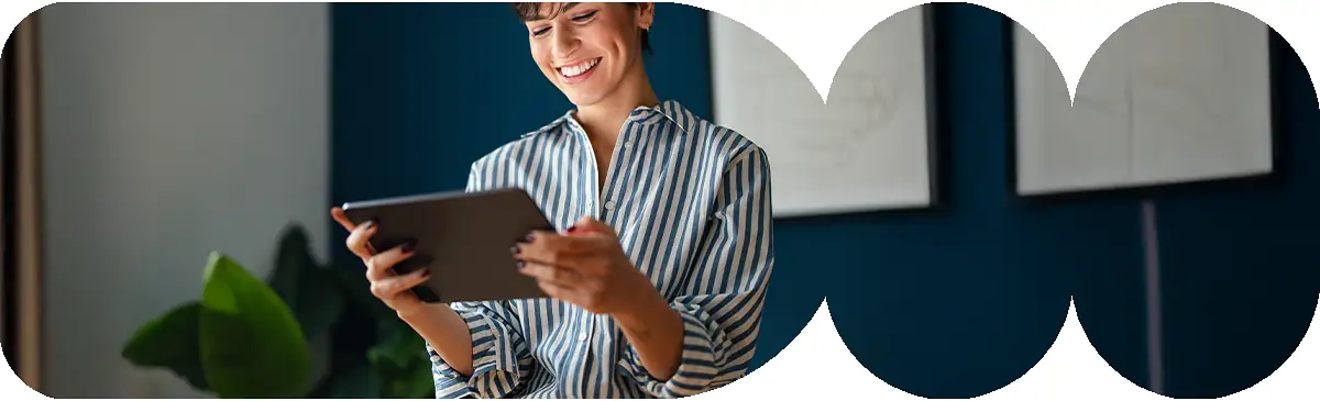 Girl on tablet smiling.