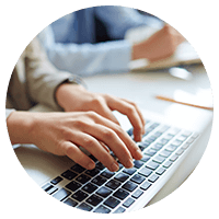 Person typing using laptop