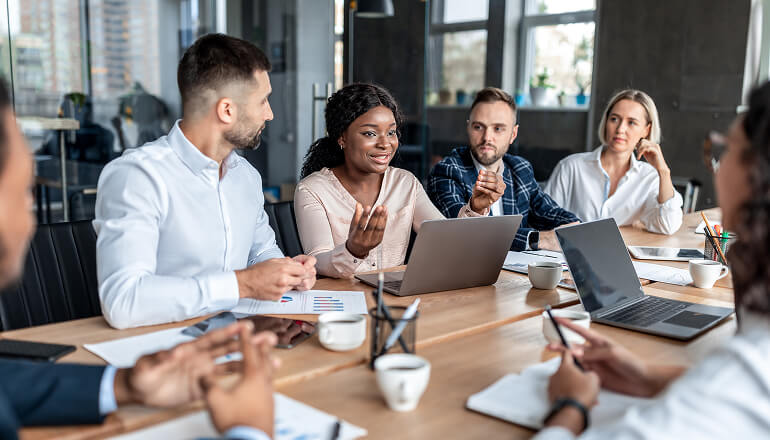 People in meeting talking.