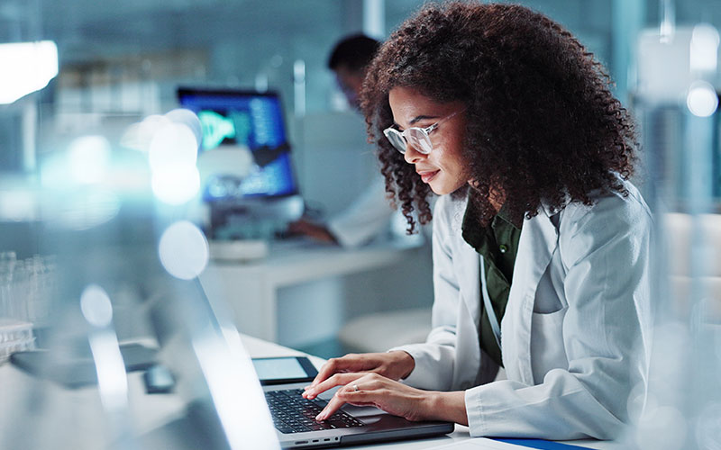 Woman in medical field on laptop