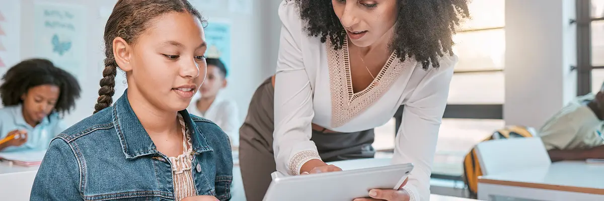 student in classroom with teacher