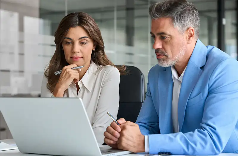 Business professional using automated workflows and self-service tools. 