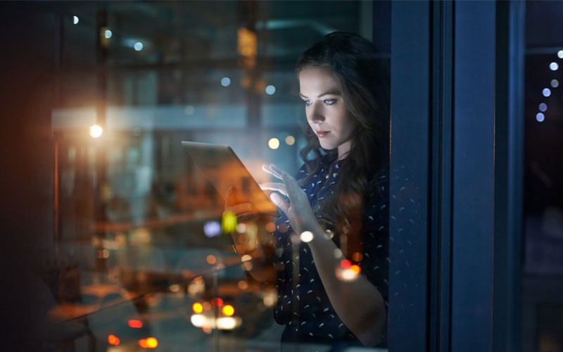 Woman using tablet device