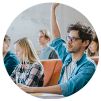 Student in lecture with hand raised