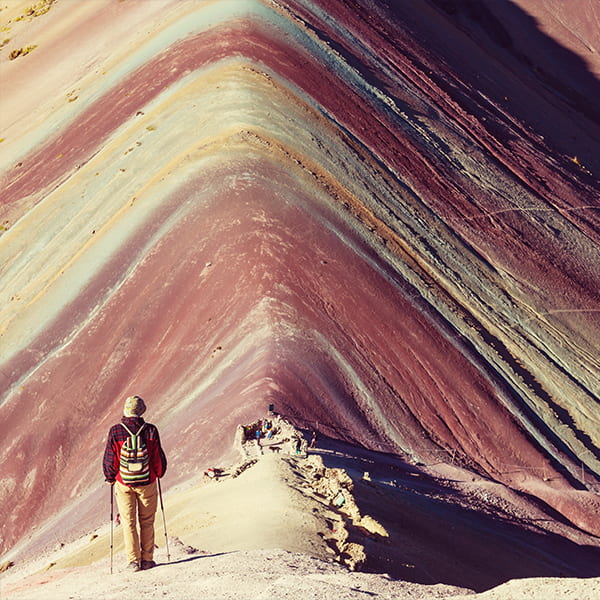 Man walking along a mountain