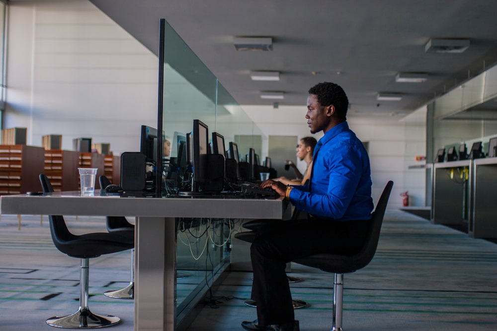 Man sat working in an open office