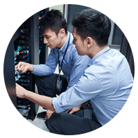 Two IT engineers work in data center