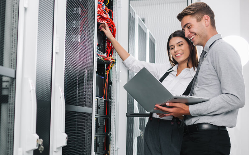 Two IT professionals in data center