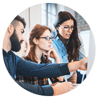 Group of  IT professionals gathered around computer