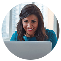 Smiling businesswoman on laptop computer