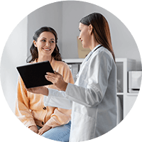 The doctor talking to the patient