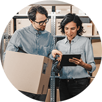 Man and woman checking the stocks using a tablet