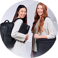 Two student holding their bags