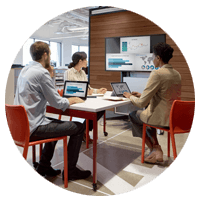 People sitting at high-top table to collaborate