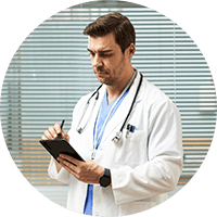 Male doctor using a tablet