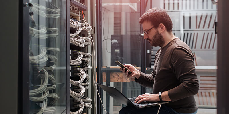 Networking engineer works in modern data center