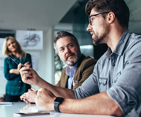 Business professionals brainstorming ideas to keep assets updated