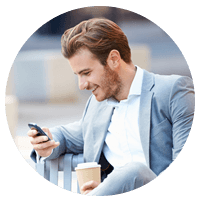 Businessman in suit on cell phone outside