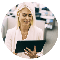 Business woman using tablet computer in office