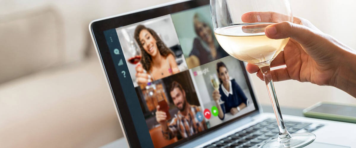 Remote team toasts to the new year remotely using collaboration tools. Microsoft Teams.