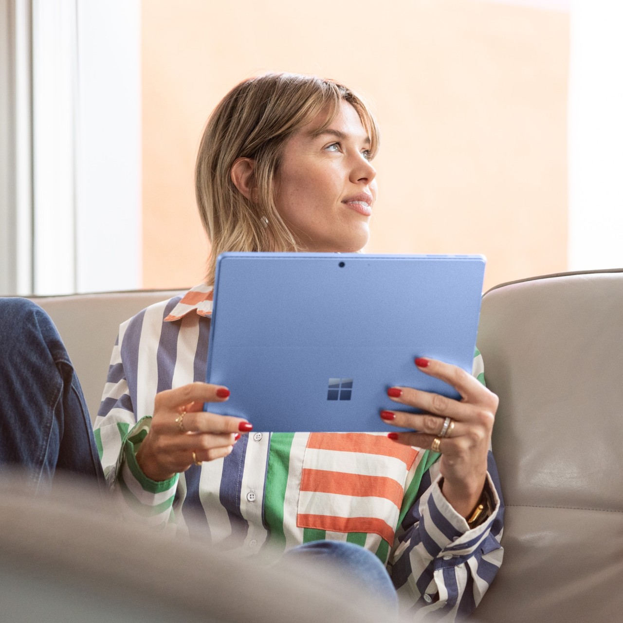 woman on microsoft tablet at home