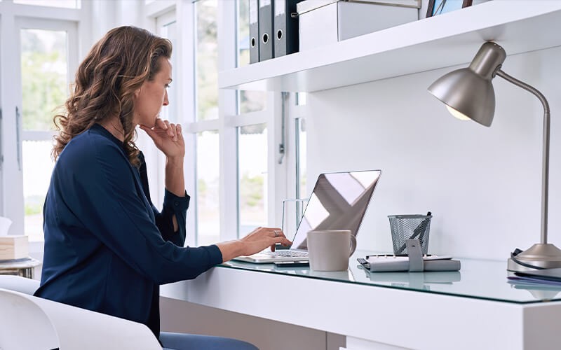 Woman working remotely using a laptop