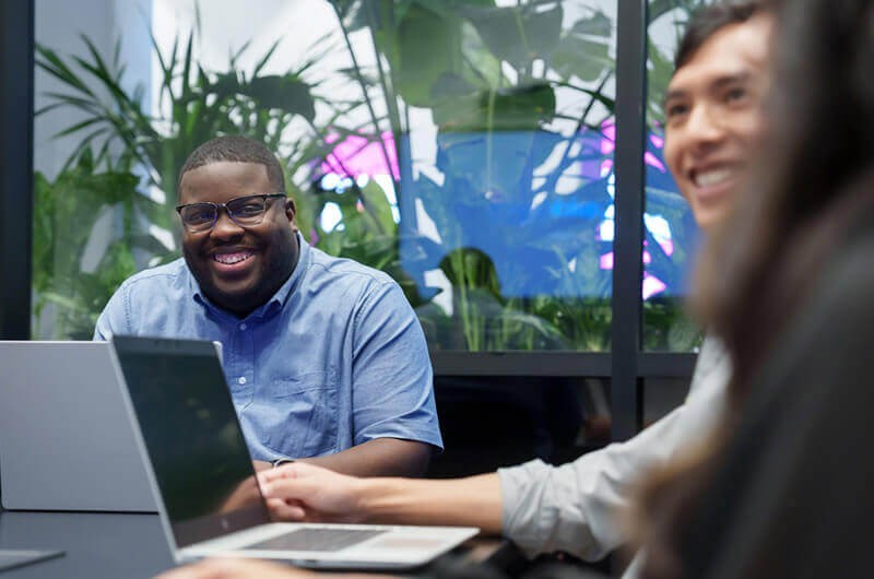 Group of interns collaborating in Insight open office space