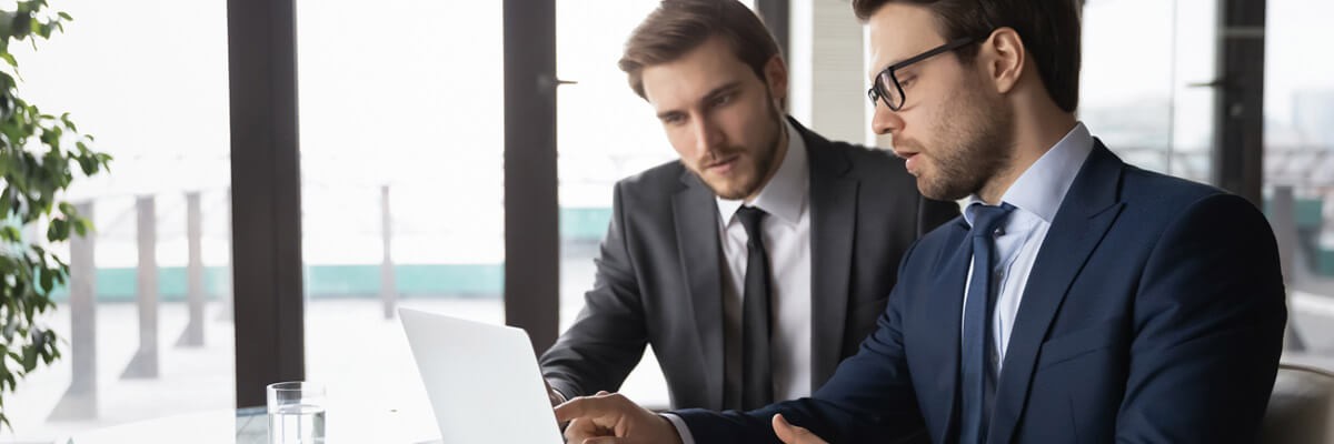 Business professional at home calculating cost of new security platform