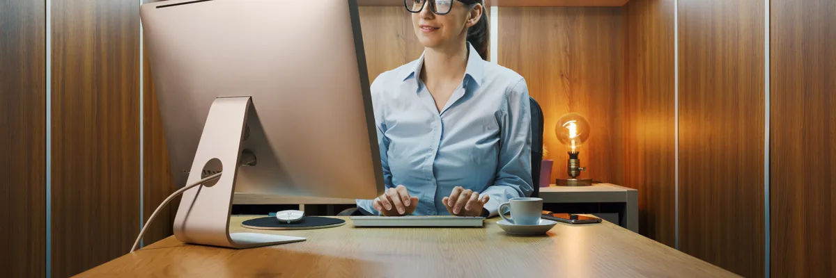 AI’s Next Decade: From Pilots to Platforms Person working on a desktop