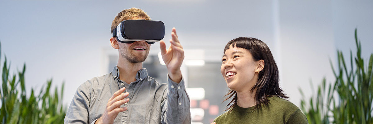 Guy wearing vr googles and laughing