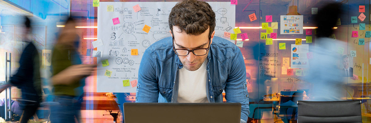 Person creating something on laptop