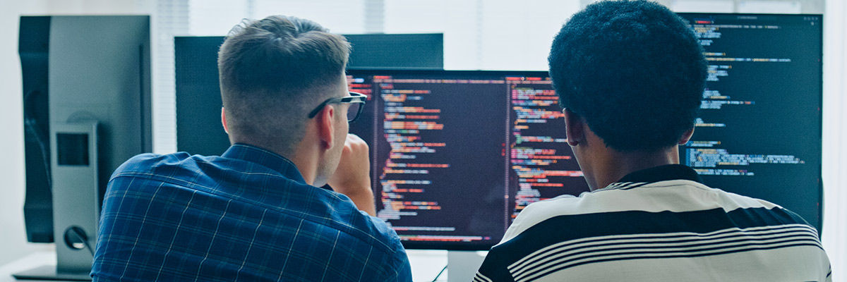 People looking over code