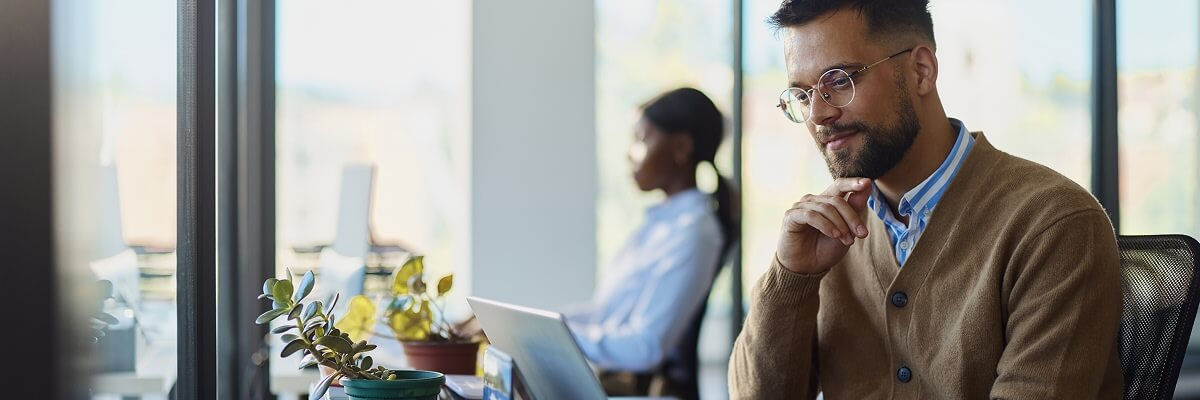 Man working on laptop.