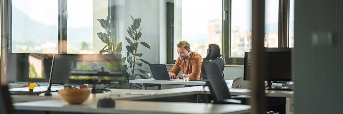 Male user in open office