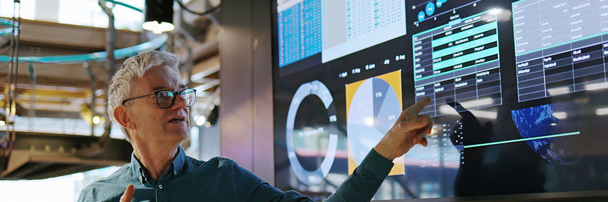 Data person pointing at graph