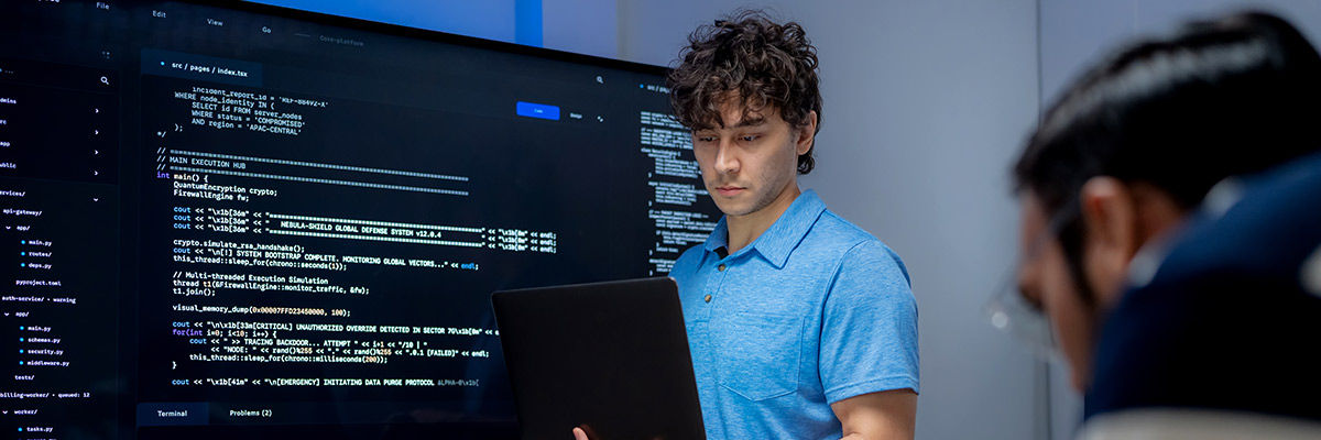 Agentic Attack Surface Male developers working on code