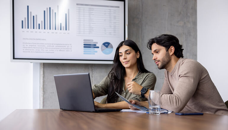 People in meeting room discussing strategy