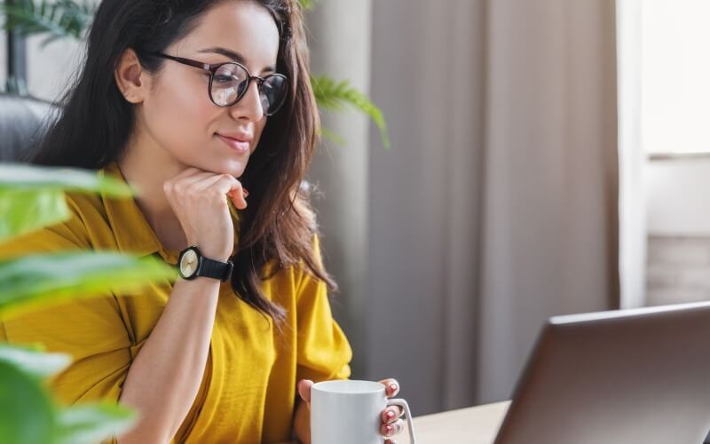Woman working from home on laptop computer