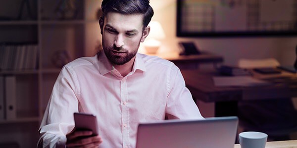 Business professional accessing laptop through 3 point verification. HP Wolf Security