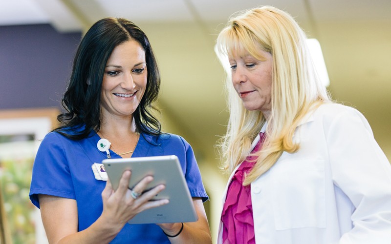 Two healthcare professionals working together