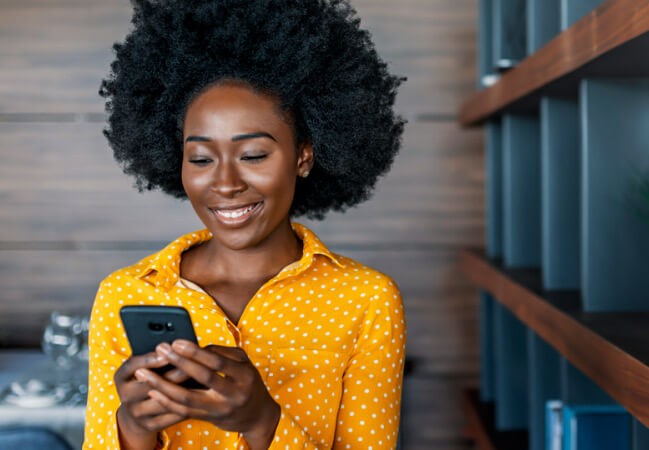 Customer using smart phone in store