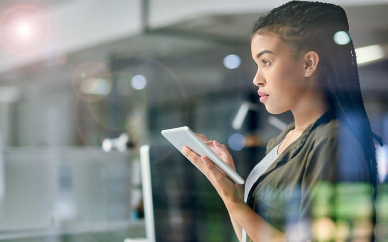 Woman working on cloud tablet 