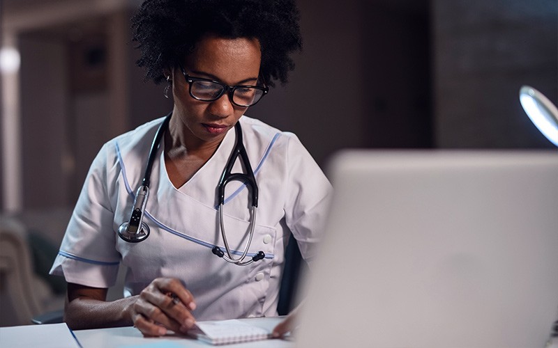 Discover what it takes to create a future ready digital workspace Smiling man reading report on tablet device