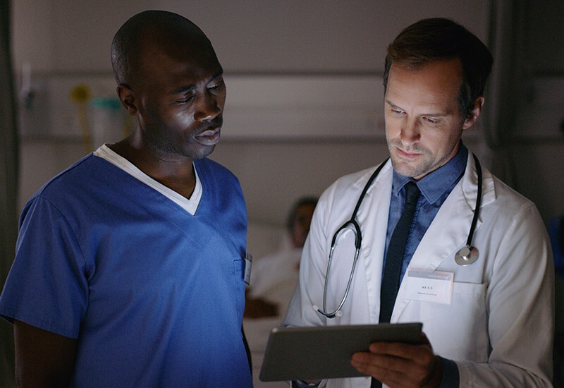 Medical staff review patient data