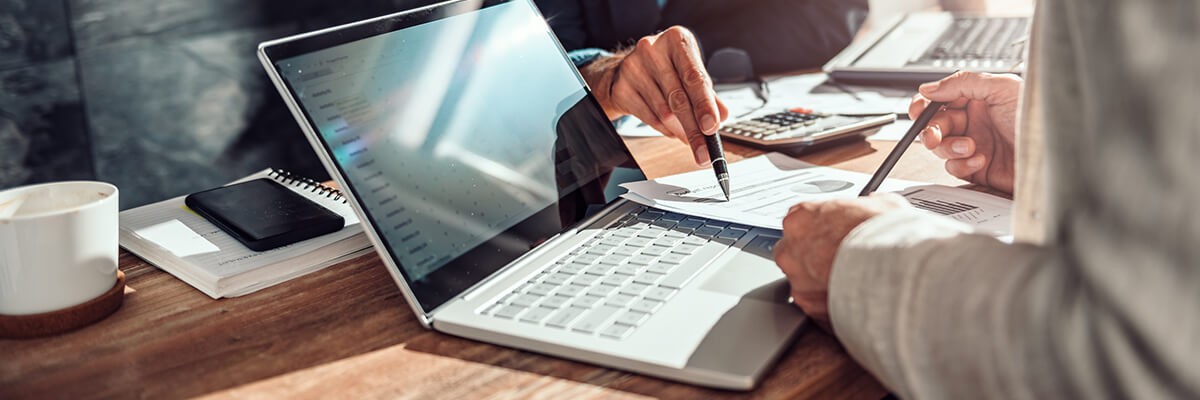 Strategic roadmap planning Close up of hands reviewing companies financial results. IT technology licensing.