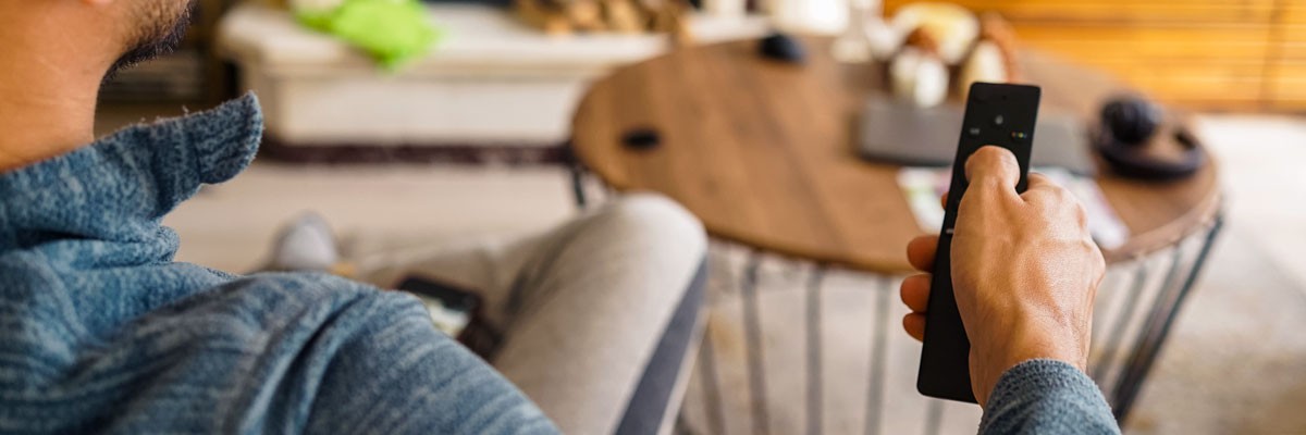 Leading Media Corporation Leverages Public Cloud Infrastructure To Manage Data, Consolidate Storage, and Enhance Collaboration Across Office Locations Man watching content from a leading media corporation